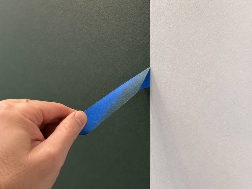 Painter's tape creating a crisp line on an accent wall